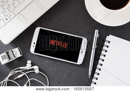 WROCLAW POLAND - DECEMBER 06th 2016: LG K10 with Netflix application laying on desk. Netflix provides streaming media and video on demand online and DVD by mail.