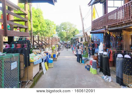 Kanchanaburi Thailand - December 2016 - Tourist are shopping at a street near Mon Wooden Bridge Sangklaburi. on December 3 2016 in Sangkhlaburi District Kanchanaburi Province Thailand.