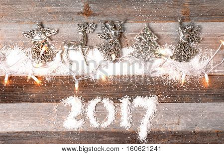 Happy New Year 2017. Christmas decoration ornament on snow.
