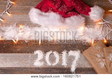 Christmas decoration. Santa hat and gifts. Happy New Year 2017 holiday.
