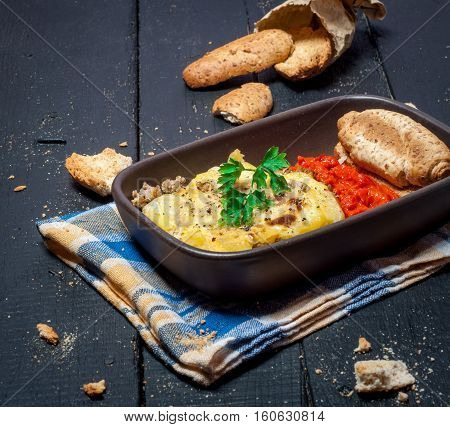 Homemade Moussaka served with bread and chutney (East European cuisine)