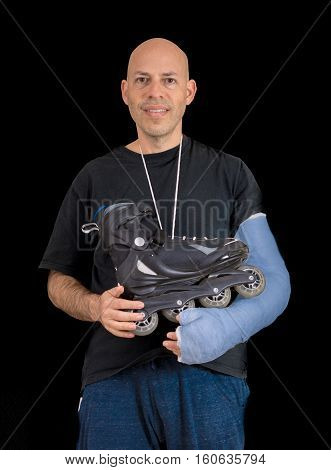 Young Man Wearing An Arm Cast After A Skating Accident