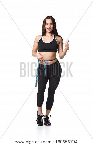 Athletic fitness woman helthy sport isolated white background young female health muscles copy space black clothes smilling attractive beautyful stretch activity