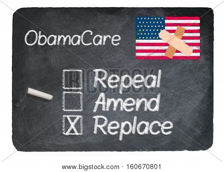 Obamacare health plan choice for replace written in chalk on a chalky natural slate blackboard isolated against white background