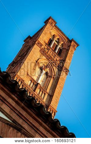 Church tower street view. San francesco abbey bell tower. Bologna Italy.