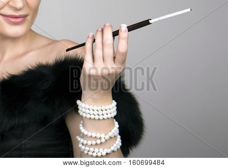 The Mouthpiece Is In The Hands Of Gorgeous Woman A Beautiful Woman Smokes While Enjoying