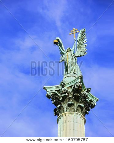 Statue On Top Of Column On Heroes Square In Budapest, Hungary Heroes' Square In The Summer On A Sunn