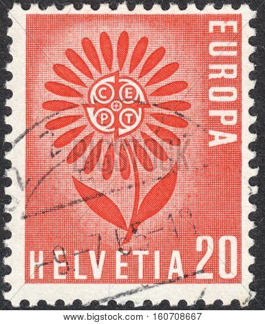 MOSCOW RUSSIA - CIRCA NOVEMBER 2016: a post stamp printed in SWITZERLAND shows a flower the series "Eurostamps" circa 1964