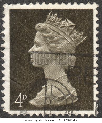 MOSCOW RUSSIA - NOVEMBER 2016: a post stamp printed in the UNITED KINDOM shows a portrait of Portrait of Queen Elizabeth II circa 1970 - 1977