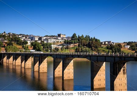 Roman bridge over the Minho River in Portomarin Spain