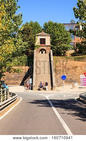 PORTOMARIN SPAIN - AUGUST 12: Pilgrims ascending the Roman staircase on August 12 2016