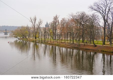 Panorama of an old Prague, bridges and embankment of Vitava river, Czechia