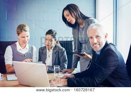 Business people dicussing at meeting in conference room at office