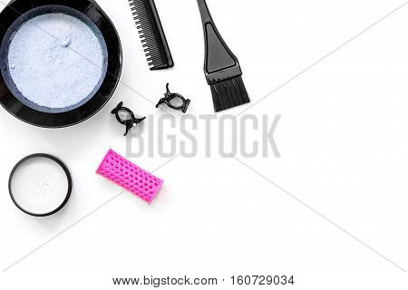 Tools for hair dye and hairdye top view on white background
