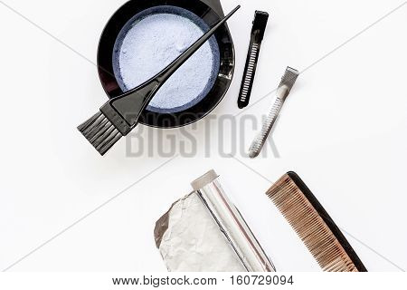 Tools for hair dye and hairdye top view on white background
