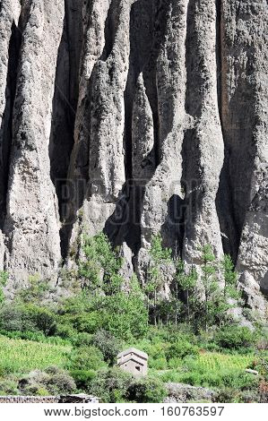 Farmhouse near a cliff at the village of Iruya on Argentina andes