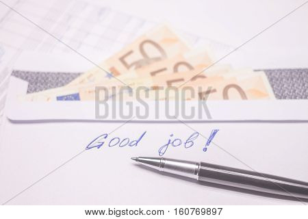 envelope with evro bills and good job sign