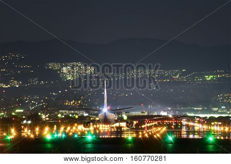 OSAKA, JAPAN - MAY 5, 2015: Boeing 737-500 taking off from the Itami International Airport in Osaka, Japan in the night.
