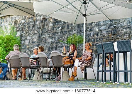 People At Street Restaurant In Ascona Town Of Switzerland