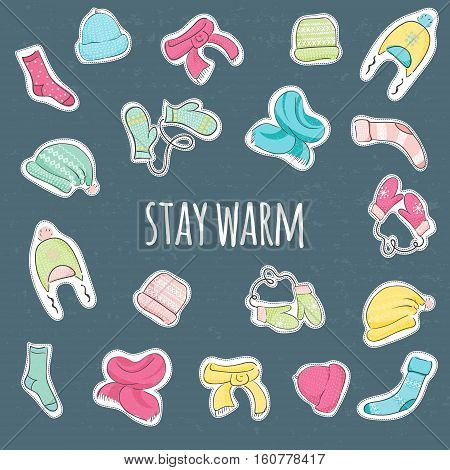Cet of stickers with Knitted accessories and inscription "Stay Warm". Hats scarves mittens socks. Warm clothes background.