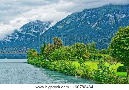 Bridge Over Brienz Lake And Brienzer Rothorn Mountain Bern Switzerland