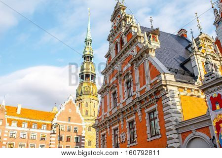 View on the central square with famous house of Blackheads and cathedral tower in Riga city, Latvia