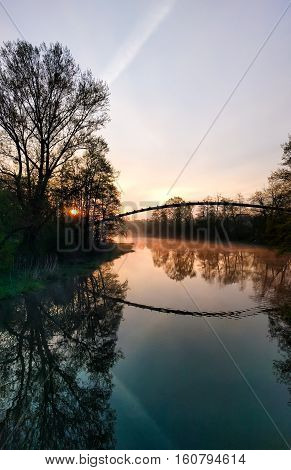 Sunset scene with reflection on lake concept
