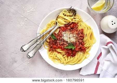 Spaghetti Bolognese In A White Plate.top View.