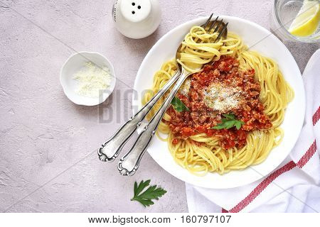 Spaghetti Bolognese In A White Plate.top View.