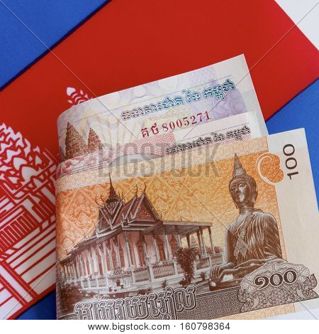 Cambodian riel currency and the Cambodian flag.