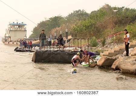 CHIANG RAITHAILAND-APR 32016 : Lifeguard and Triathlon athlete sporter in Golden Triangle Triathlon on April 3 2016 in Chiang sean district Chiang raiThailand.
