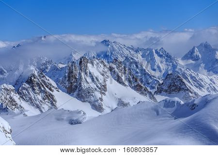 Alps, view from Mt. Titlis in winter. Titlis is a mountain located on the border between the Swiss Cantons of Obwalden and Bern.