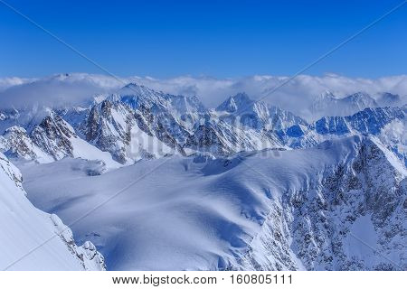 Alps, view from Mt. Titlis in winter. Titlis is a mountain located on the border between the Swiss Cantons of Obwalden and Bern.