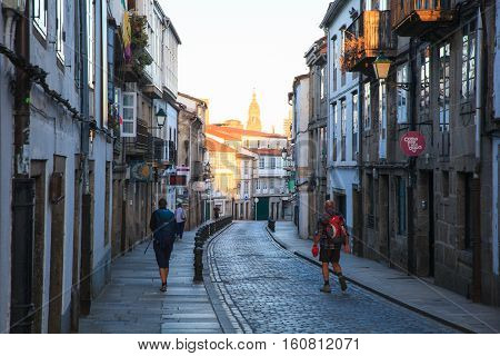 SANTIAGO SPAIN - AUGUST 17: Pilgrimns go to the Santiago cathedral on August 17 2016