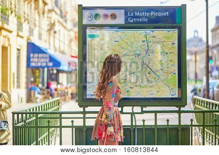 Young Parisian Woman Near The Subway Plan