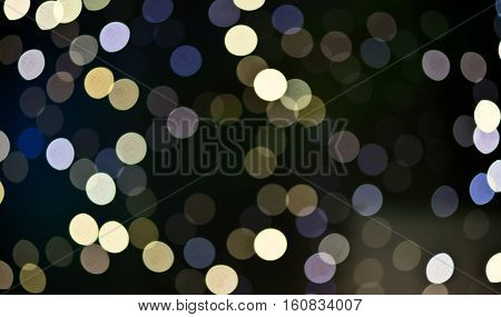 Christmas background. Festive abstract holidaysbackground with bokeh defocused lights and stars