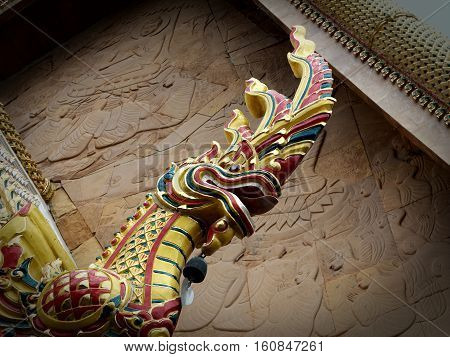 Golden Naga or Serpent king statue in buddhist temple.