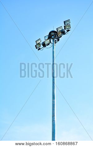 The big spotlight post under the clear blue sky.