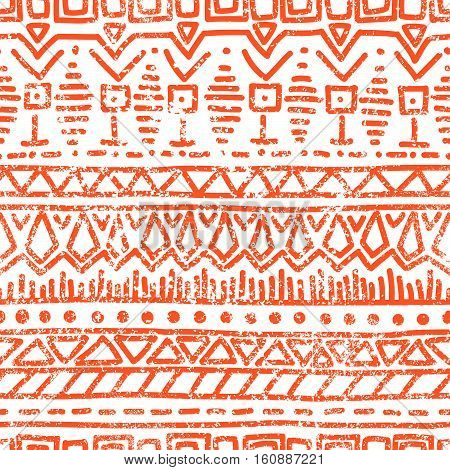 Seamless ethnic pattern. Tribal motifs. Grunge texture. Vintage geometric pattern. White and orange colors. Vector illustration.