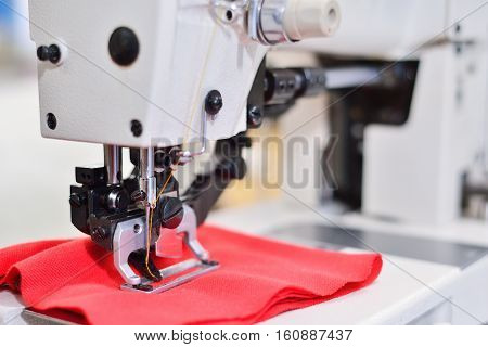 sewing machine. Equipment garment factory. The concept of the textile industry.