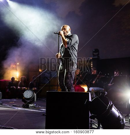 CRACOW POLAND - NOV EMBER 6 2016: Symphonica 2 Made in Poland The music of cult of underground rock metal- and punk Polish groups from years 80-these performed by musicians and soloists Filharmonia Futura on stage cinemas Kiev in Cracow. O/p Damian Ukeje