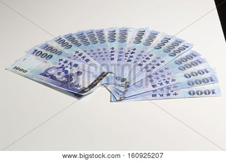 New Taiwan Dollars Fanned Out On White Background