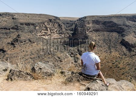 Dhofar Mountains girl looking grand canyon in Oman salalah Arabic jeep safari
