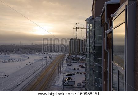 Road in the winter street. Evening, sunset