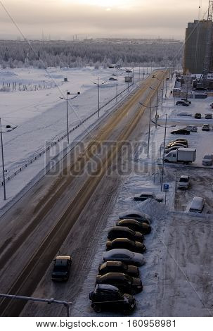 Road in the winter north street. Evening, sunset