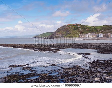 View of Aberystwyth on the Ceredigion coast Wales looking towards Constitution Hill together with the end of the Royal Pier.