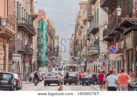 PALERMO ITALY - SEPTEMBER 7 2015: Pedestrians walking by via Maqueda famous street in old city centre of Palermo Sicily Italy.