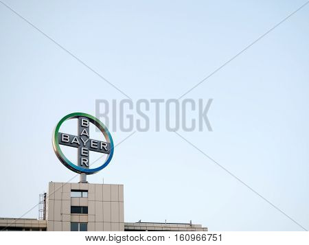 Big sign of Bayer company and part of the building against the sky in Berlin Germany