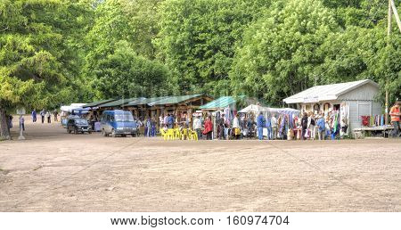 VALAAM RUSSIA - August 10.2008: Souvenirs market near the pier of the island of Valaam. Tourists buy souvenirs