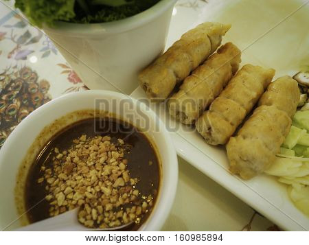 Set of Vietnam food on table that including sausage vegetable chillisheet of flavor and sauce